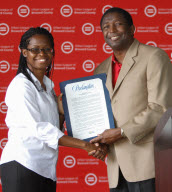 Broward Commissioner Dale V.C. Holness presents a proclamation to Urban League&nbsp; of Broward County President/CEO Germaine Smith-Baugh.