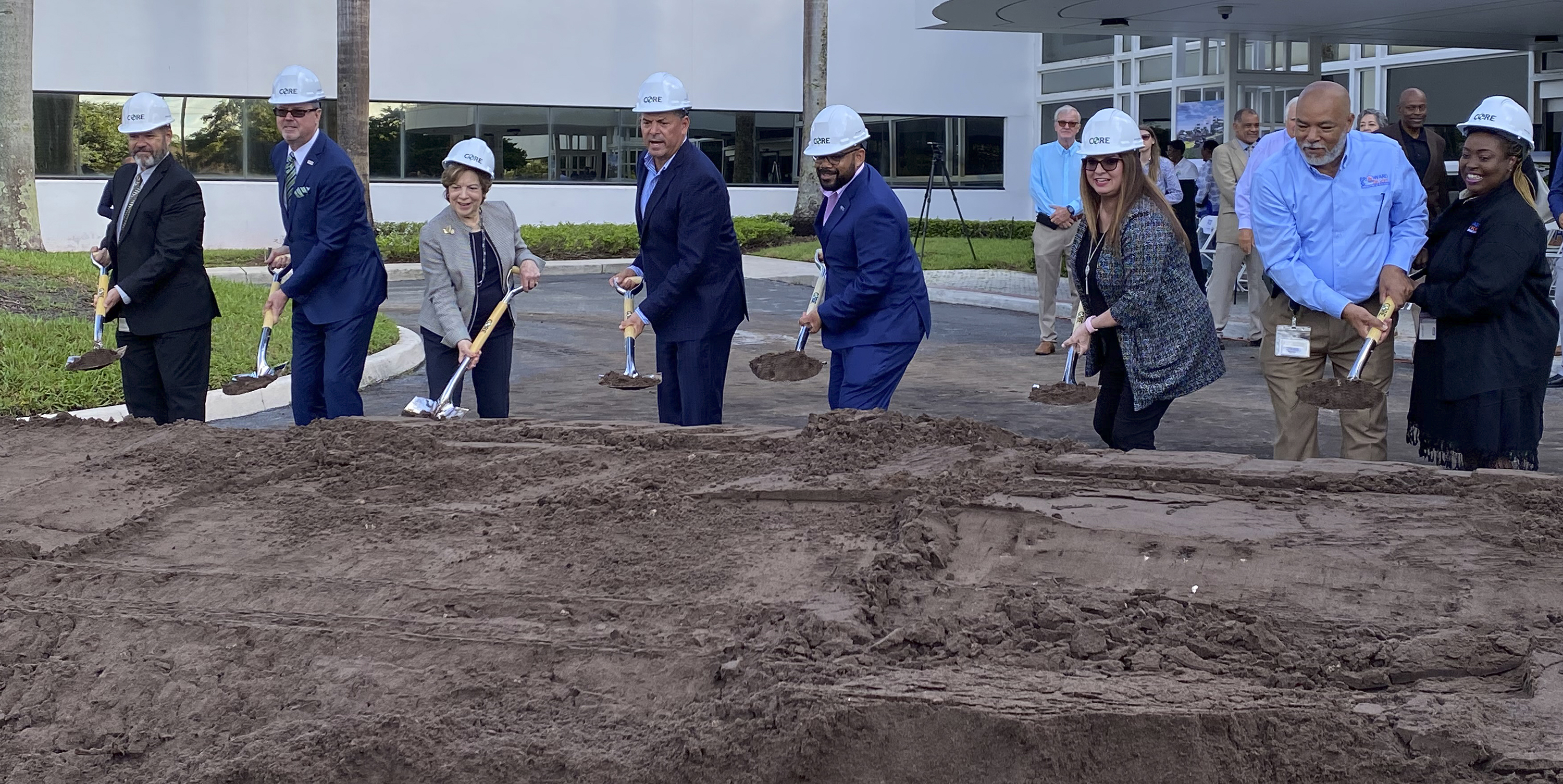 Pictured L to R Assistant County Administrator Kevin Kelleher, Vice Mayor Lamar Fisher, Senator Nan Rich, Mayor Michael Udine, Supervisor of Elections Joe Scott, County Administrator Monica Cepero, Director of Voting Equipment Center Logistics Dozel Spencer, Supervisor of Elections Chief Deputy Mary Hall.