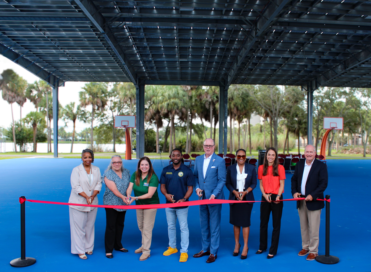 Ribbon cutting at Reverend Samuel Delevoe Memorial Park on September 18, 2024. Pictured from left to right - Dr. Tameka Bradley Hobbs, Library Regional Mgr. AARLCC, Valeria Wolberg, Senior Parks Mgr., Moncia Cepero, Broward County Administrator, Daryl Campbell, FL Rep. District 99, Lamar Fisher, District 4 Broward County Commissioner, Tracy Roach, Chief of Staff for Commissioner McKinzie, Dr. Jennifer Jurado, Dep. Dir. Resilience, and Dan West Parks Dir.